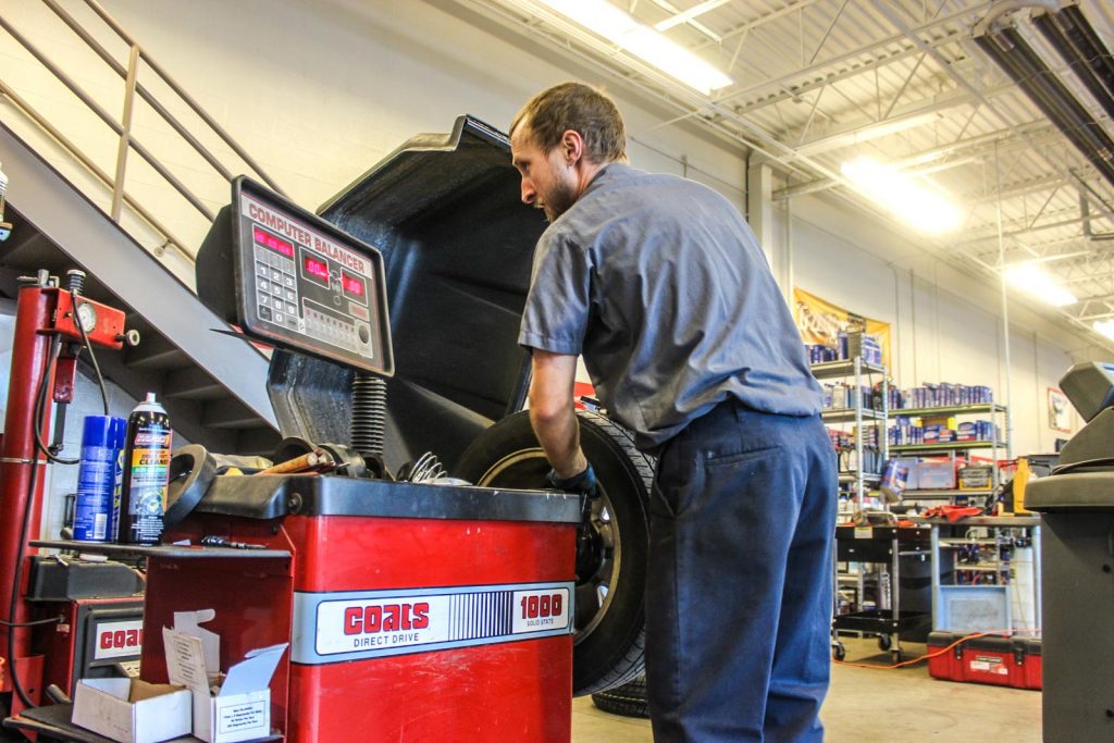 Rad Air employee balancing tires