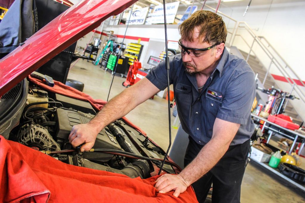Rad Air technician working under the hood