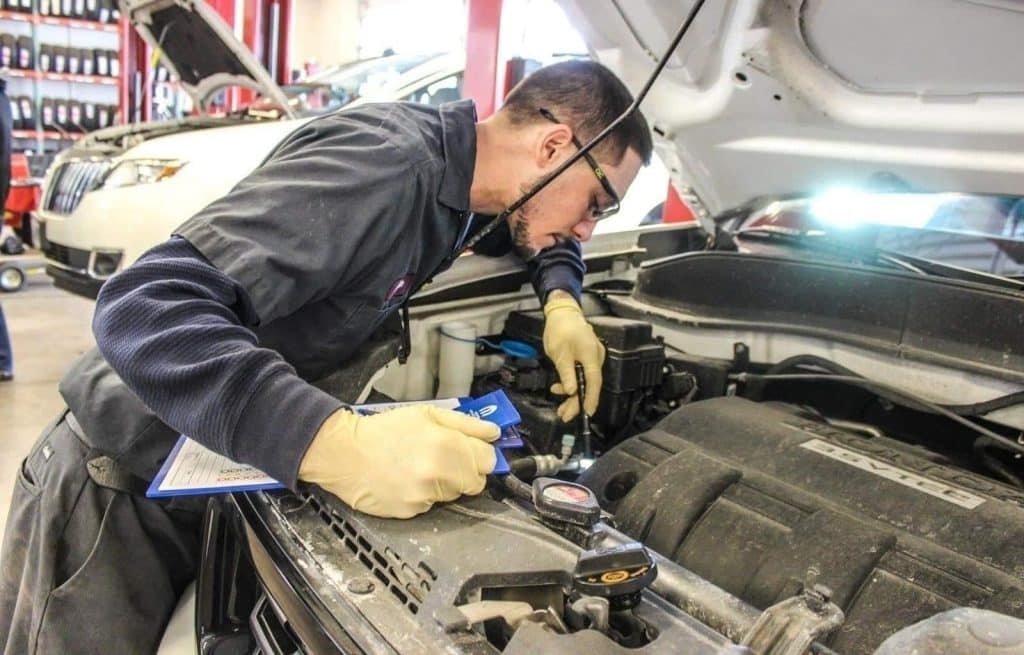 a mechanic inspecting a vehicle