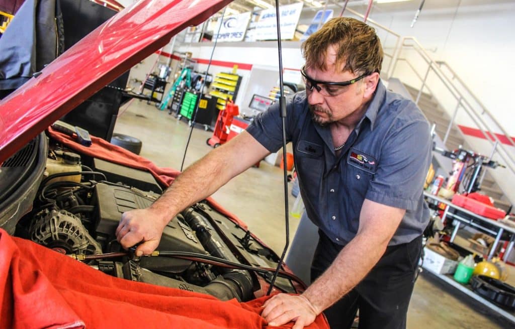 a mechanic inspecting a vehicle