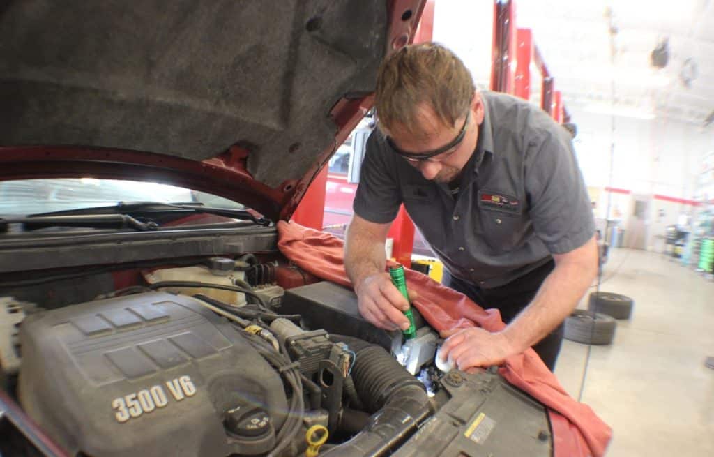 a mechanic inspecting a vehicle