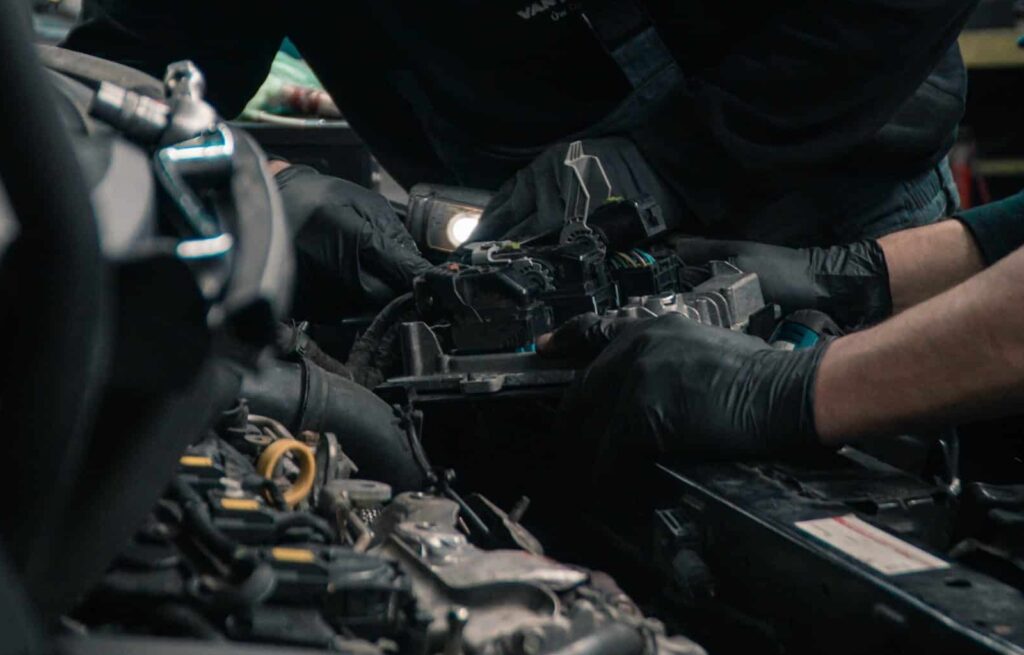 Mechanics working on car