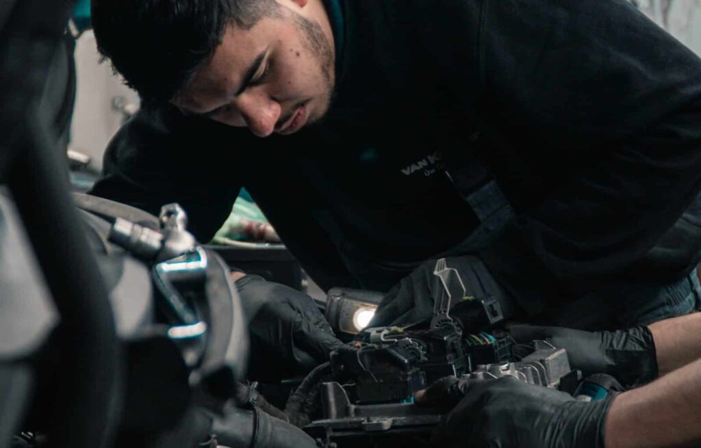 mechanics working on car