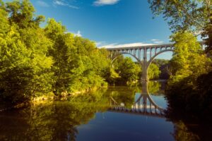 Arch bridge spanning a river in Cuyahoga Valley National Park | Rad Air - STAGING Arch bridge spanning a river in Cuyahoga Valley National Park